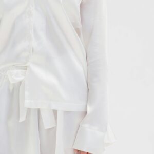 Elegant white satin sleepwear showcasing comfort and style for cozy nights.